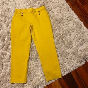 Ladies cool fitting yellow slacks.